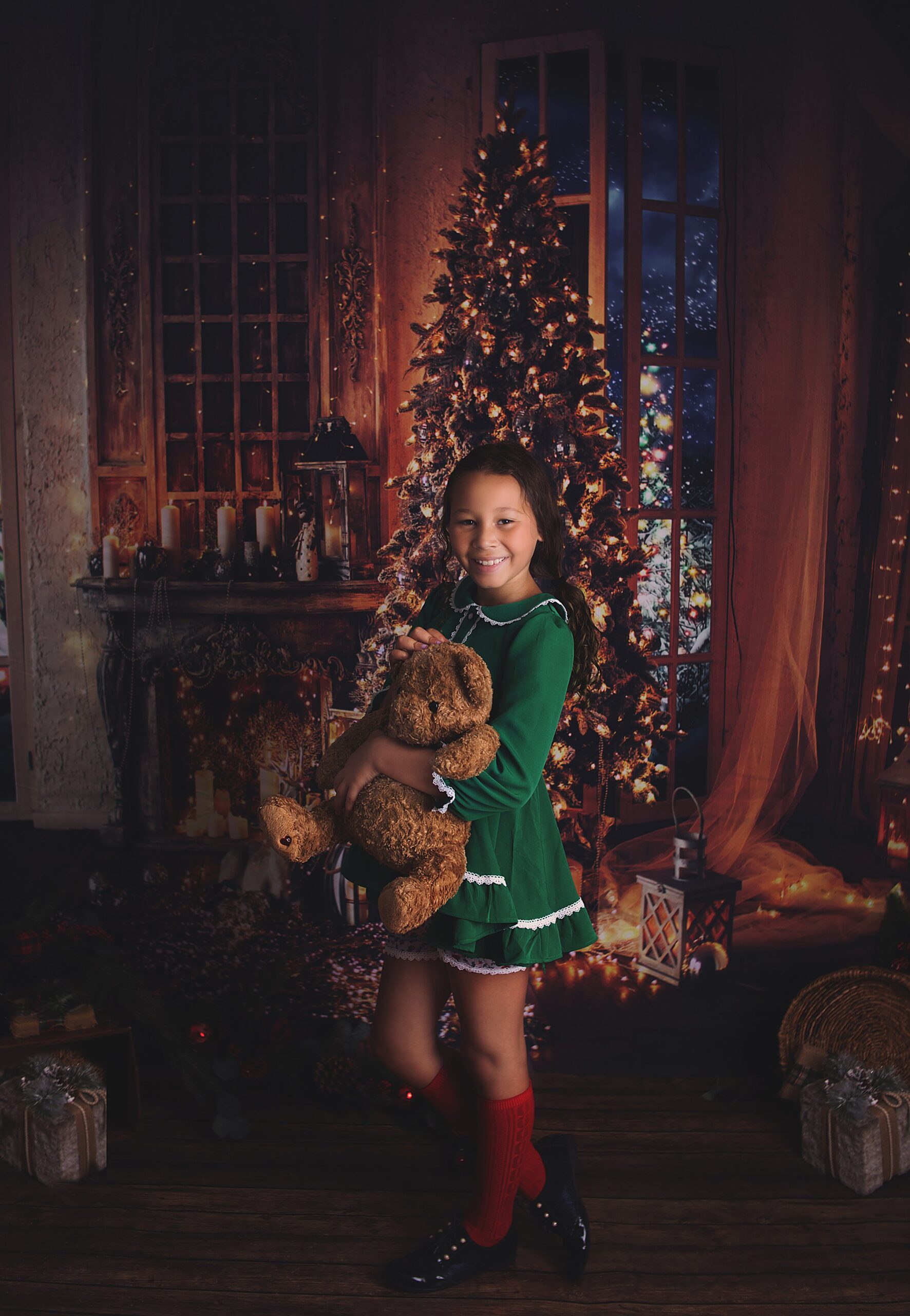 girl holding teddy bear, Christmas Tree, Green dress, happy, Franklin Tennessee Baby Photographer