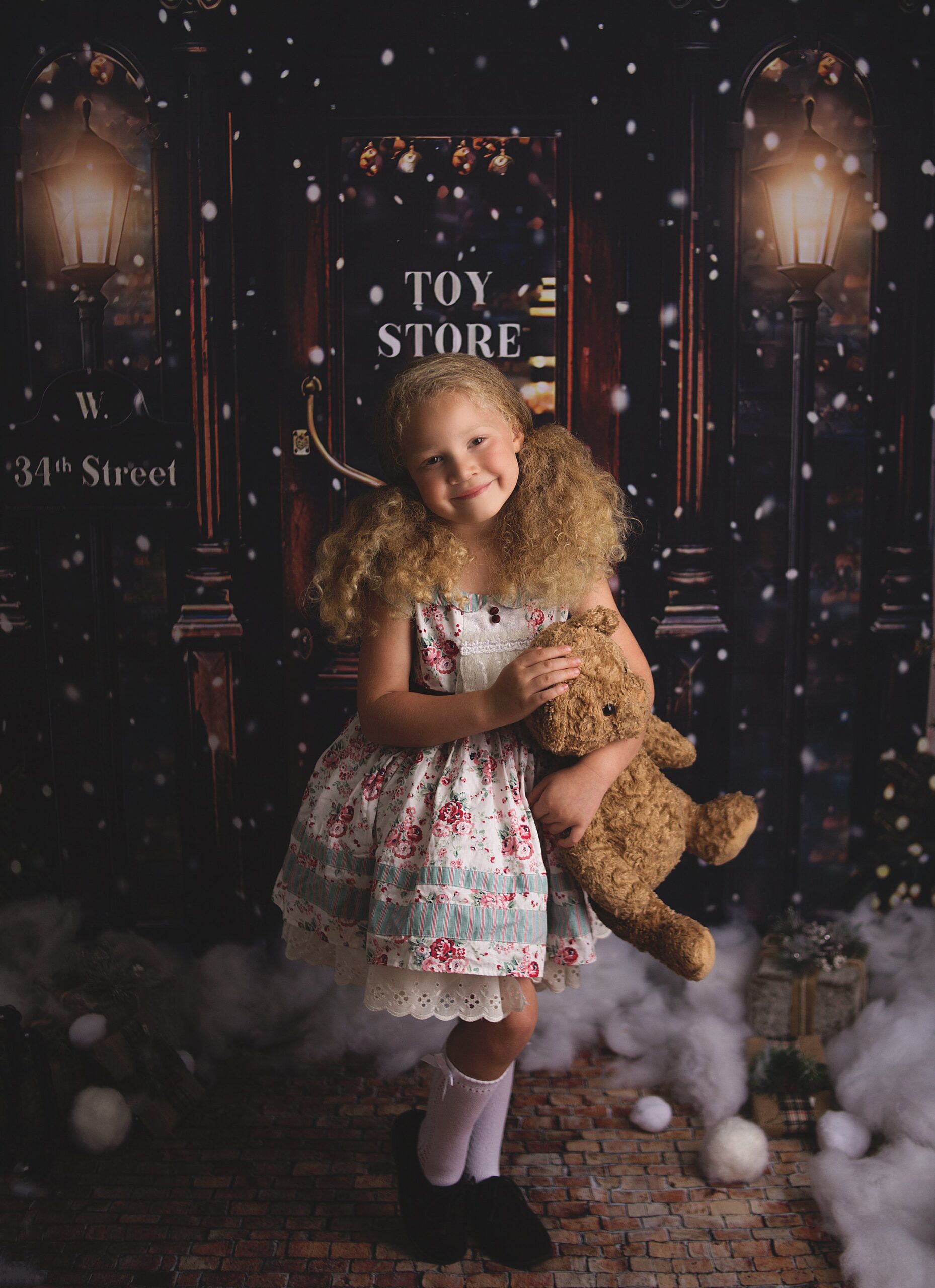 girl holding teddy bear, christmas toy store, flower dress, Franklin Tennessee