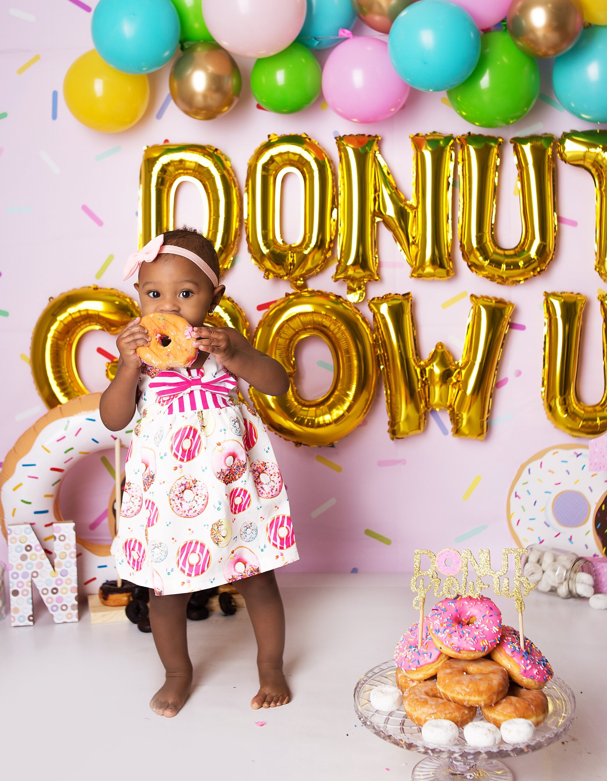 girl, eating donut, cake smash in mount juliet photo studio, franklin tennessee