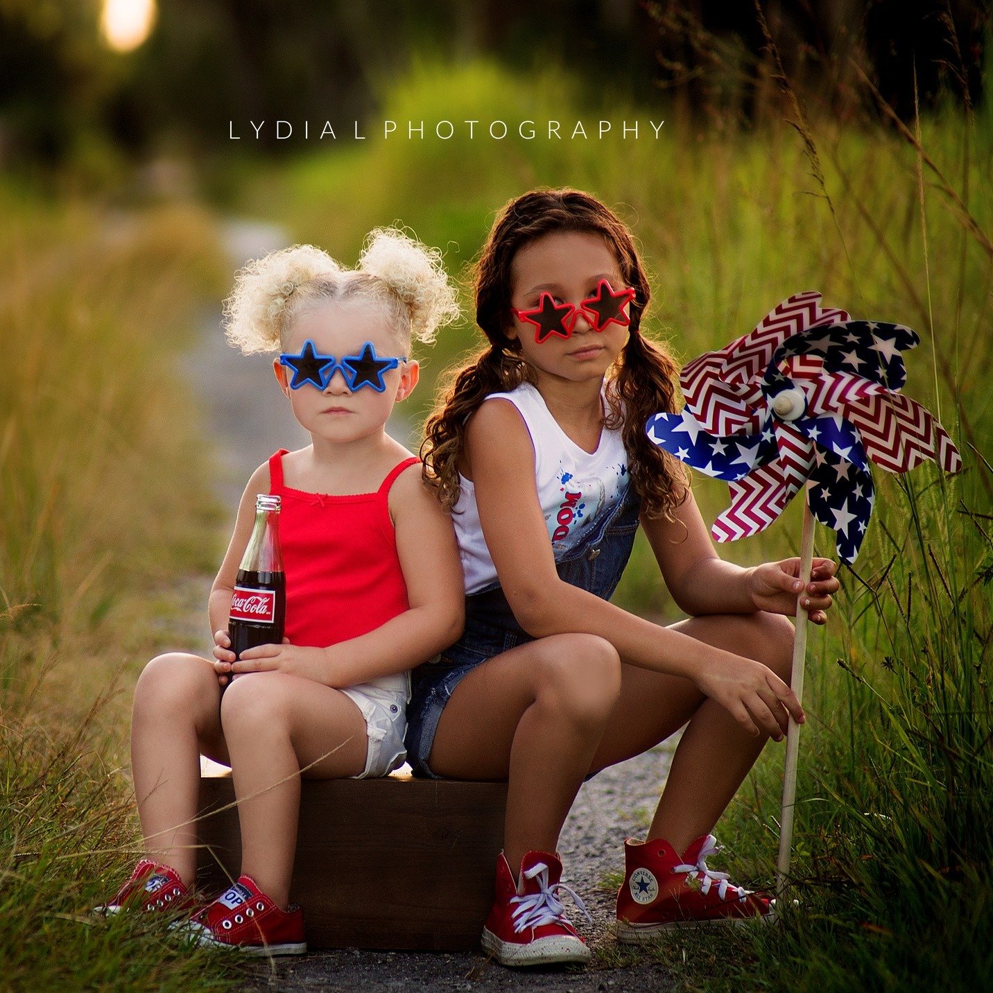 Two girls wearing red white and blue during summer mini session photoshoot in Mt. Juliet, Tn