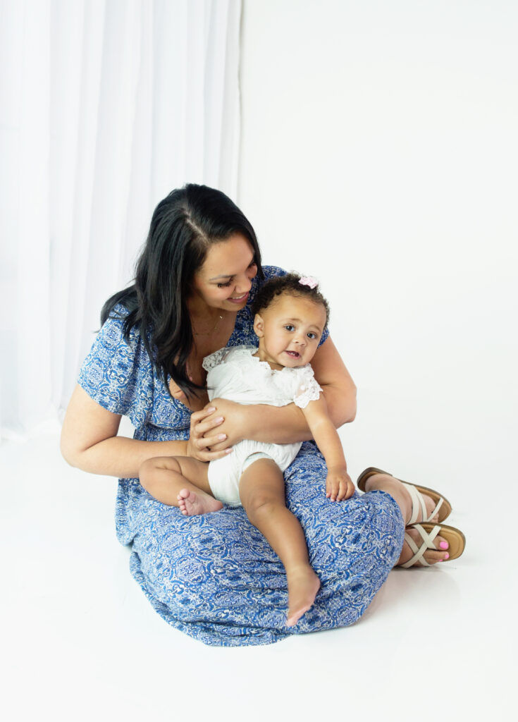 Mom laughing with her daughter during family photoshoot in Franklin Tennessee photography studio 