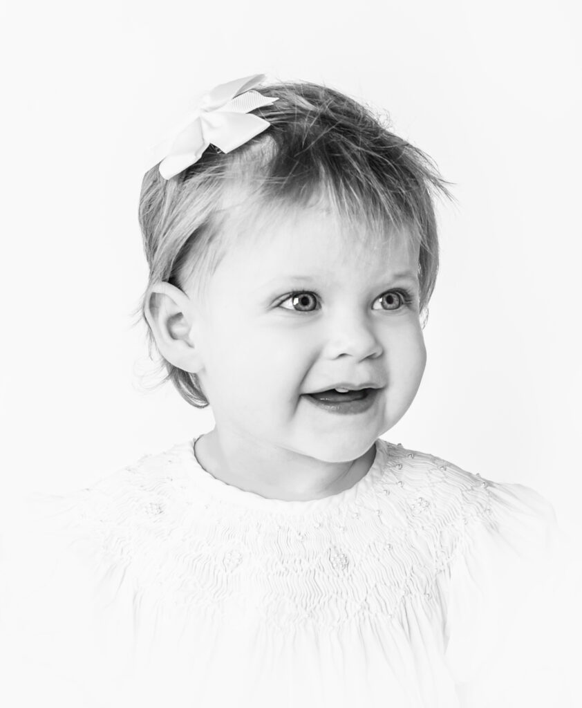 Black and white heirloom photo of little girl during photoshoot with Nashville, TN photographer in Mount Juliet TN photography studio 