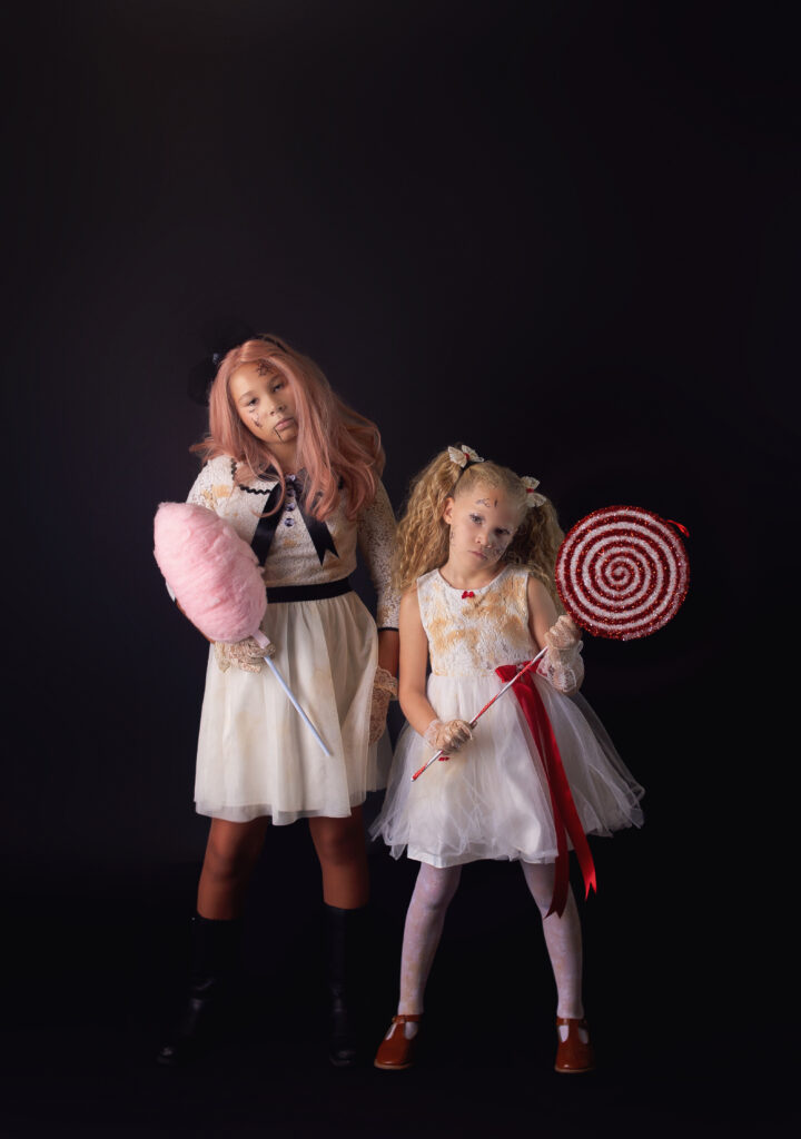 Two sisters dressed as creepy dolls for Halloween during Halloween mini session photoshoot with Mount Juliet Tennessee photographer in Nashville, TN Photography studio 