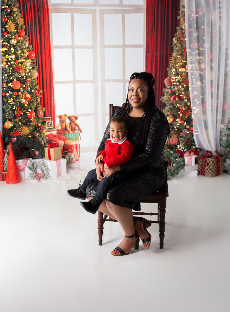 Mother wearing sequin dress holding her son during Christmas mini session photoshoot with Mount Juliet, TN Photographer 