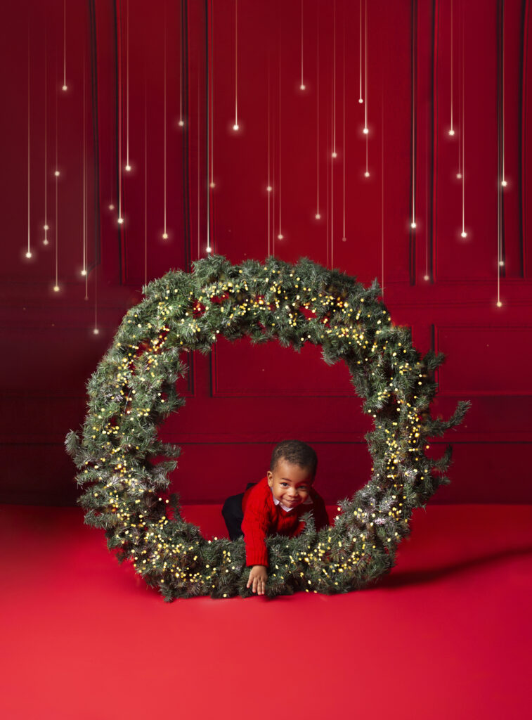 Mount Juliet, Christmas mini session, little boy crawling through giant wreath 