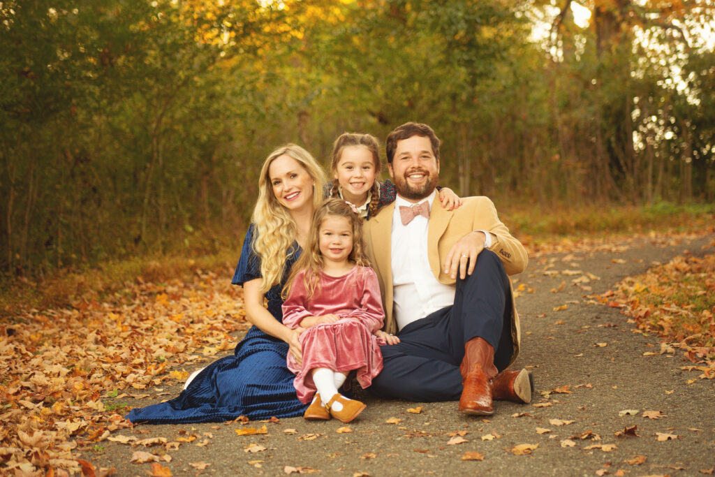 Family sitting in park in Nashville, TN during fall min session photoshoot with Mt. Juliet Tennessee photographer 