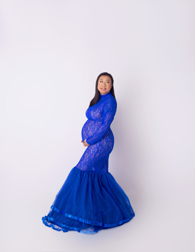 Pregnant women wearing blue glam gown during maternity photoshoot with Nashville, TN maternity photographer 