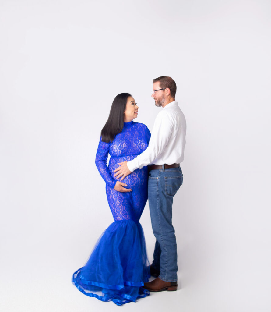 Pregnant women wearing blue gown during maternity photoshoot with Nashville, TN photographer in Mount Juliet, TN Photography studio 