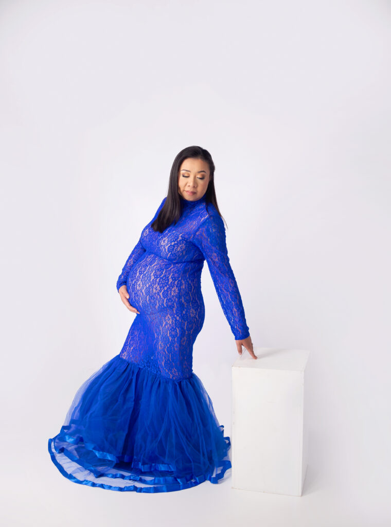 women wearing blue gown during maternity photoshoot with Mount Juliet, TN Newborn photographer 